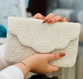 Cream Wave Textured Clutch